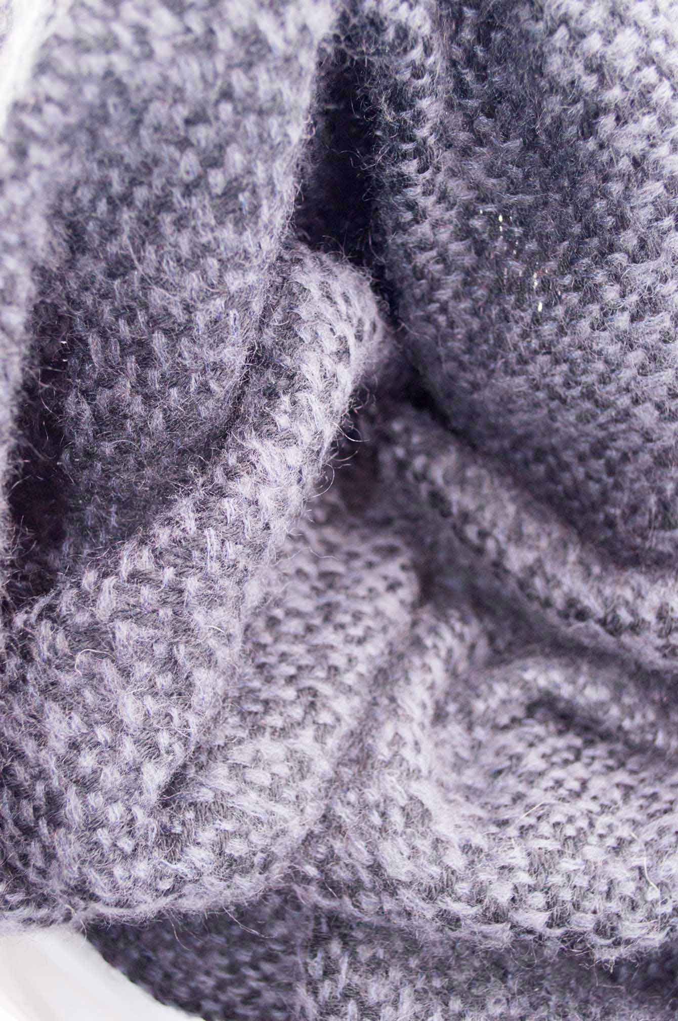 Throw blanket created with blue lavender mohair, and black wool.   Technique: Throw blanket hand-woven in a traditional way on non-mechanical looms in the 7th arrondissement of Paris in France.  Finishes: Right edge. Double stitching. 4 pompons.  Size: 140 x 190 cm.  Single piece / 1 copy only.
