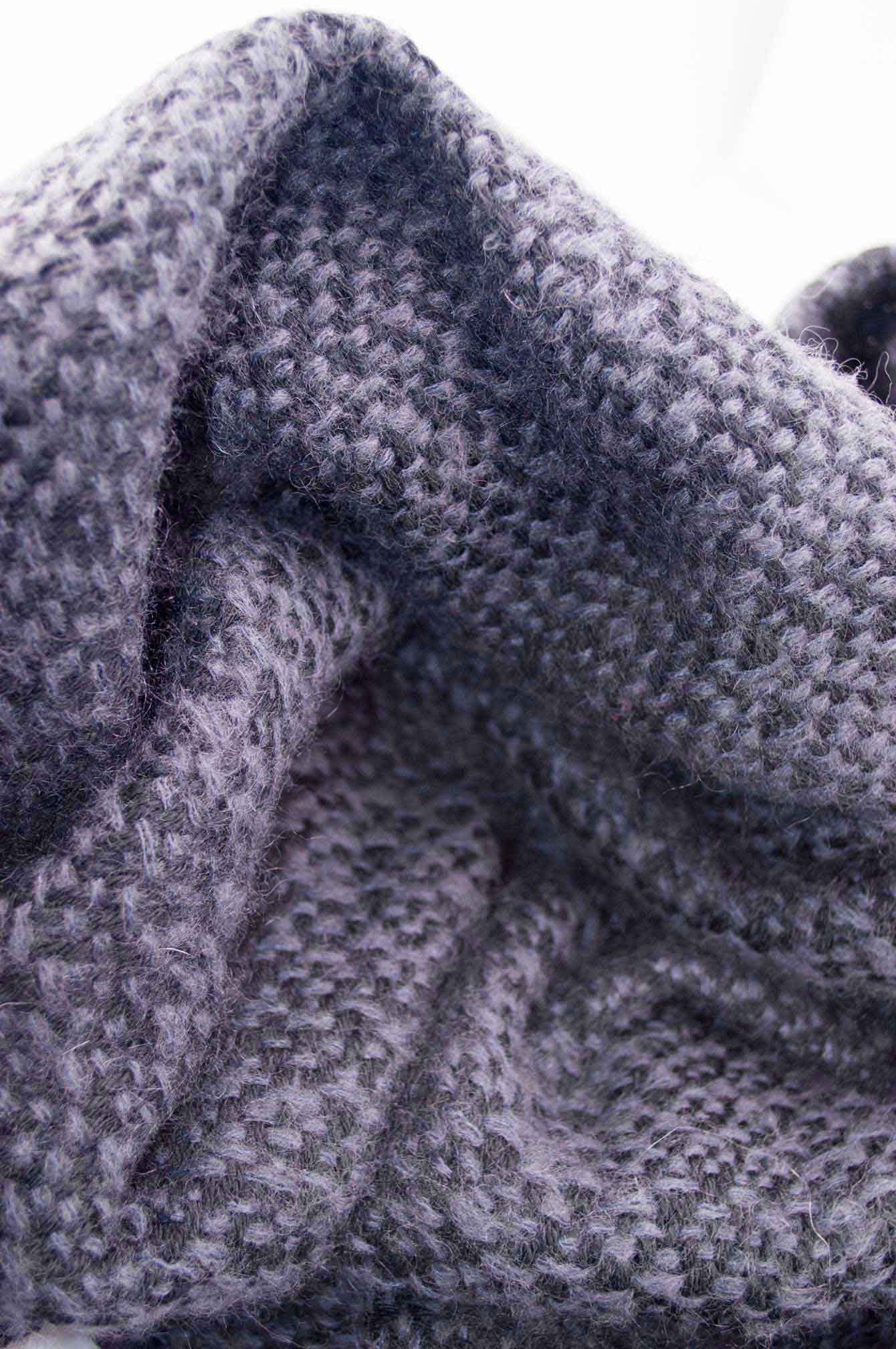 Throw blanket created with blue lavender mohair, and black wool.   Technique: Throw blanket hand-woven in a traditional way on non-mechanical looms in the 7th arrondissement of Paris in France.  Finishes: Right edge. Double stitching. 4 pompons.  Size: 140 x 190 cm.  Single piece / 1 copy only.