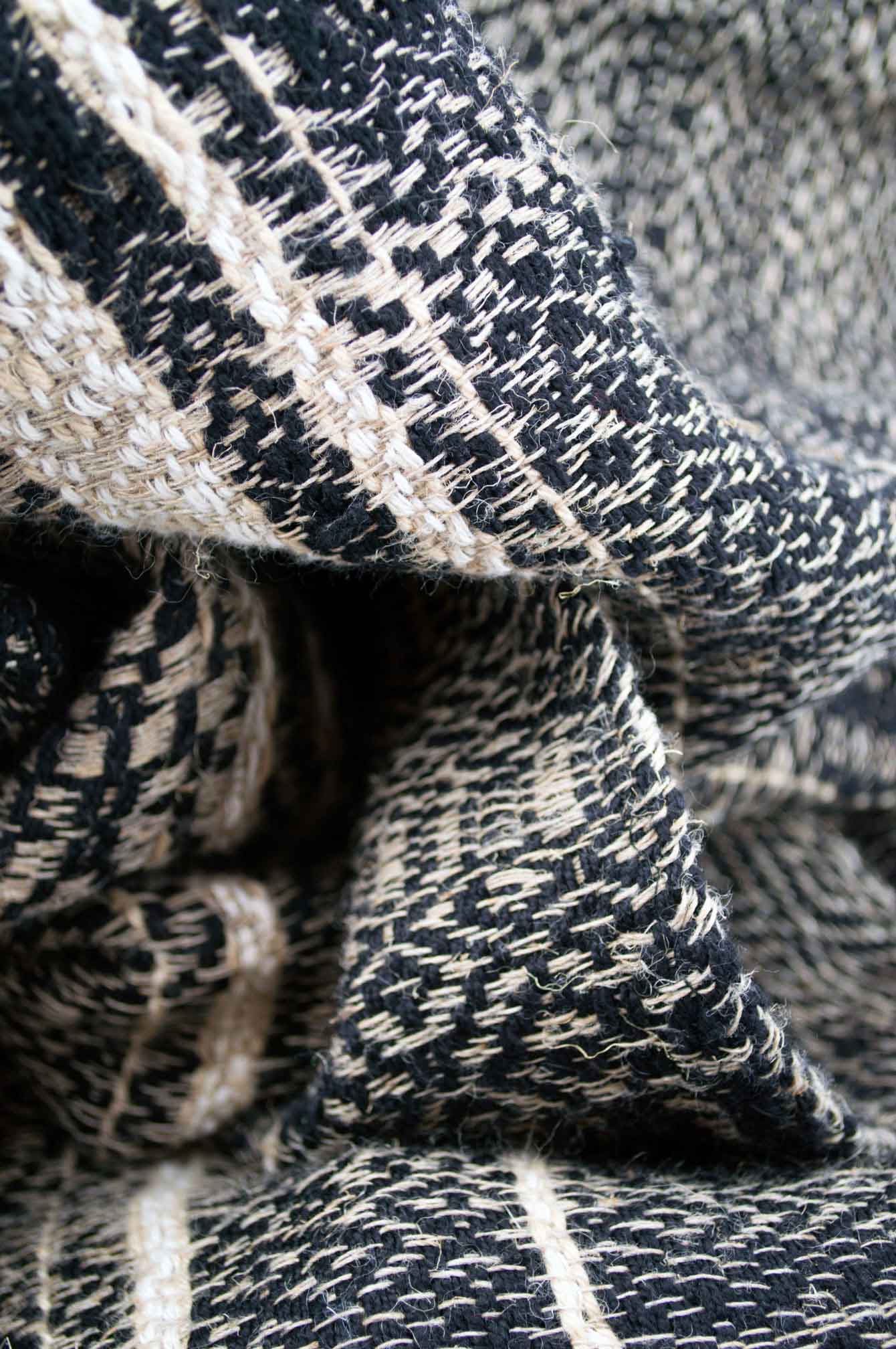 Throw blanket created with hemp, wool, linen. Union of different patterns and natural materials for the pleasure of the eyes.  Technique: Throw blanket hand-woven in a traditional way on non-mechanical looms in the 7th arrondissement of Paris in France.  Finishes: Right edge. Double stitching.  Size: 145 x 200 cm.  Single piece / 1 copy only.
